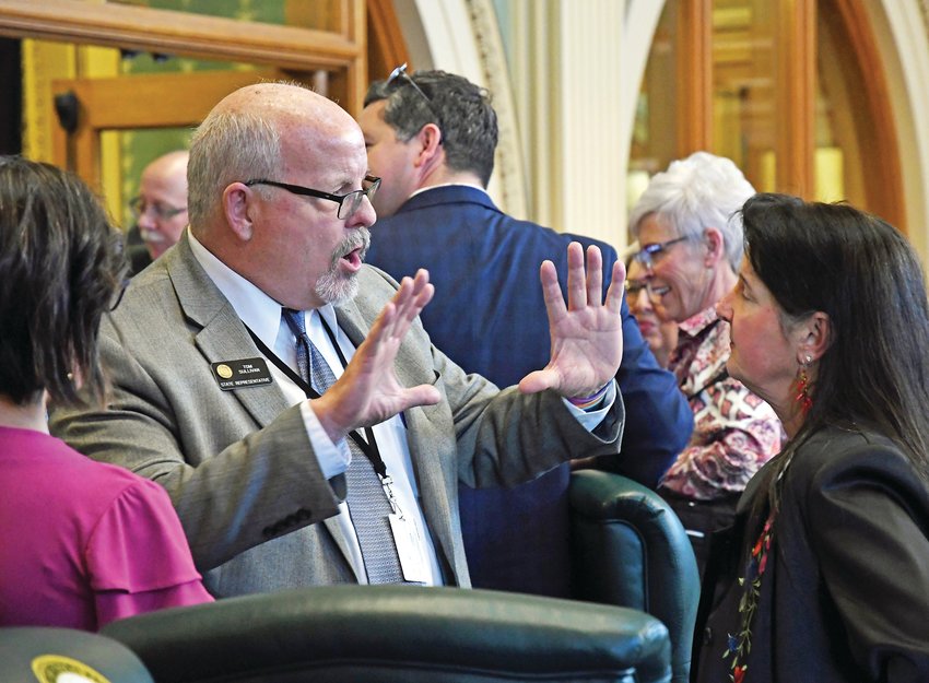 Colorado state Rep. Tom Sullivan joins other members and guests in the house chambers as the second regular session of the 72nd Colorado General Assembly convenes at the state Capitol in January 2020.