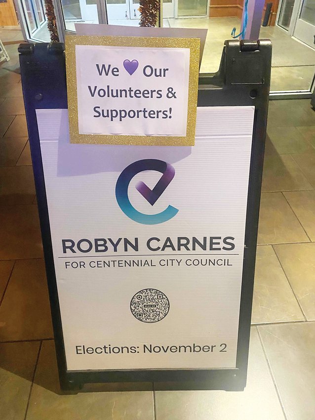 A sign with Robyn Carnes' campaign logo bears a message that says, "We (heart) our volunteers and supporters!"