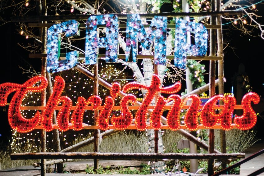 A sparkling sign adorns the entrance to Camp Christmas at Heritage Belmar Park.
