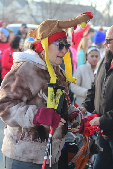 Margaret Whitney is dressed for the weather and the upcoming Thanksgiving holiday at this year's Brighton Turkey Trot. She walked the 5K course in a time of 1:05.09.
