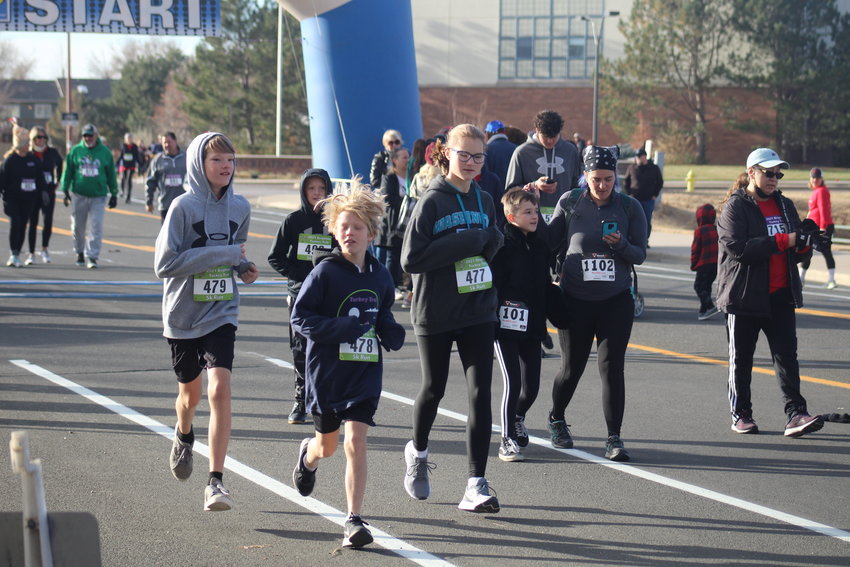 A 5k run among family members starts at Brighton's Turkey Trot Nov. 20. At left, Tony DiLorenzo finished in a time of 40:40. Rocco DiLorenzo, center, finished in a time of 41:59. At right, Maddi DiLorenzo finished in a time of 33:40. R