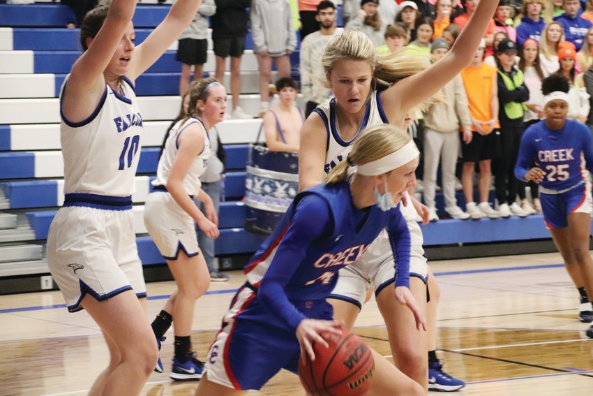 Cherry Creek's Kinsey Christianson is surrounded by Highlands Ranch players during the Dec. 8 girls basketball game. Highlands Ranch pulled away in the fourth quarter for a 64-52 win.