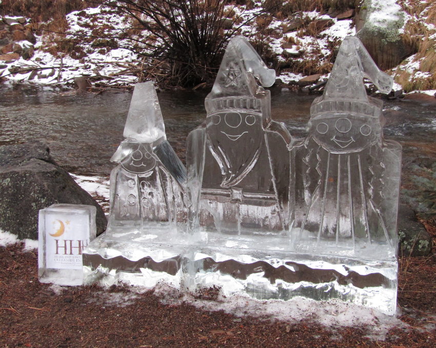 Three ice children hang out near Bear Creek by Highland Haven Creekside Inn.