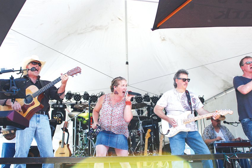 A band plays at the Tailgate Tavern during Parker Days in June 2018.