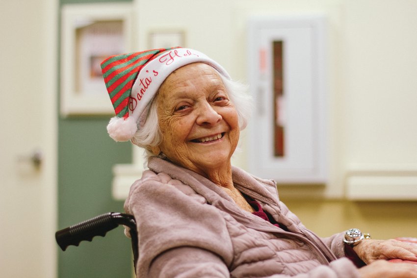 Miss Rita, a Willowbrook Place resident is all smiles at the Memory Care Center's Cookie Challenge and Exchange in December.
After being extremely isolated during much of 2020, long-term care facilities like Willowbrook in south Jefferson County were able to restart resident enrichment programs and family visits in 2021 thanks in large part to vaccines.