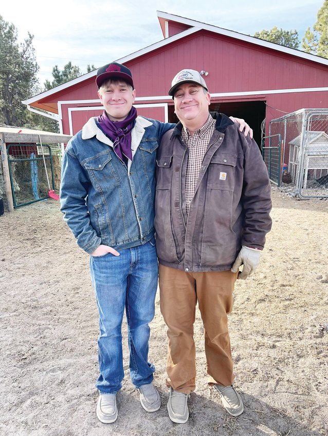Brian Gillen, left, and his father, Brian Gillen Sr., pose together in front of the barn on their family ranch in Elizabeth.