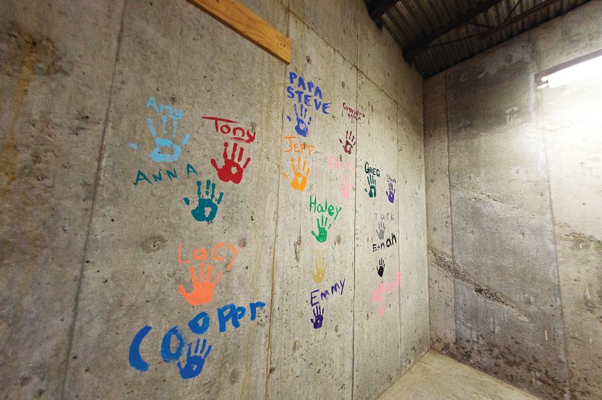 In a proper hand-off to the Miners Alley Playhouse, new owners of the historic Meyer Hardware building in downtown Golden, Steve Schaefer, his kids, and grandkids commemorated the event with their handprints.