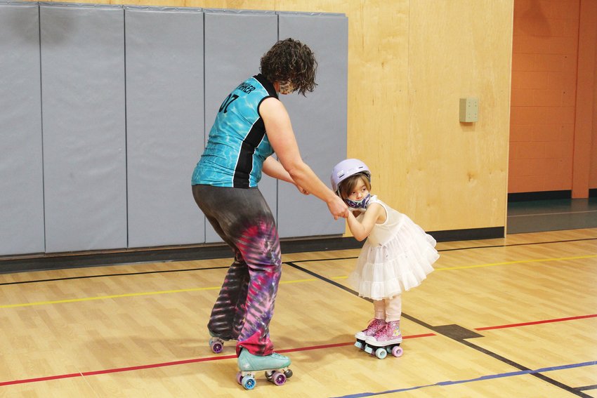 Idaho Springs’ Cris Slaymaker rollerskates with her daughter, Kerry, 4, on Jan. 8 at the rec center. Clear Creek Metropolitan Recreation District has launched indoor roller skating sessions every Saturday from 10:30 a.m.-noon. The sessions are free with membership, or a $5 drop-in fee for non-members. Attendees must bring their own skates.