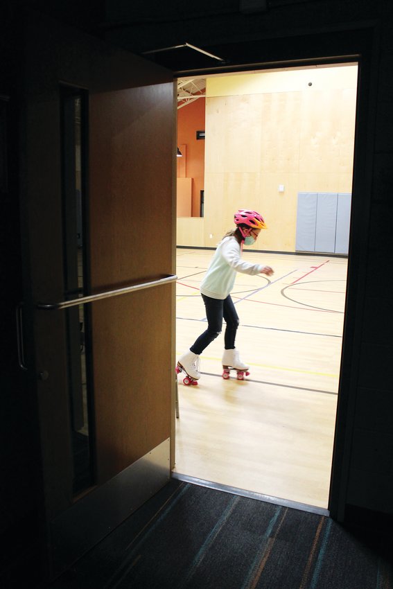 Idaho Springs’ Audrey Amann, 11, skates past the door to the rec district gym during a Jan. 8 indoor rollerskating session. This year, the rec district will host indoor rollerskating sessions every Saturday from 10:30 a.m.-noon.