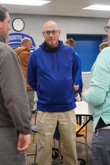 Ted Bergquist talks with baseball team parents after his introduction Jan. 13 as the Bluedevils' new baseball coach.