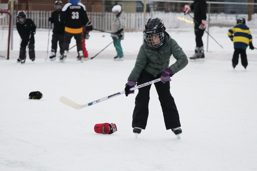 Arwen Gibbons, 8, completes a slalom drill during the Jan. 10 youth hockey skills camp at Georgetown's Werlin Park.