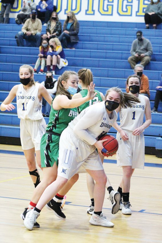 Clear Creek’s Kim Pappen, front right, holds onto a rebound during a Jan. 15 home game against Byers.