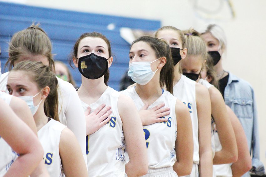 Clear Creek's Loralei Murphy, third from left, and her teammates stand for the national anthem during a Jan. 15 home game against Byers.