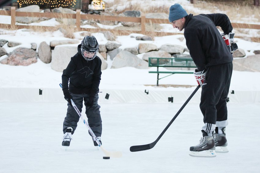 At right, Mike DiNardo gives Noah Nelson, 9, instructions during the Jan. 10 youth hockey skills camp at Georgetown's Werlin Park.