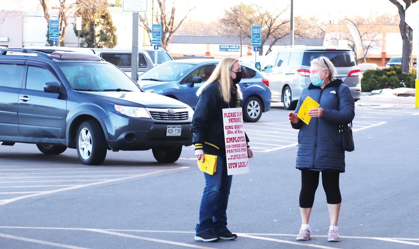 UFCW Local 7 representative Margie McGraw speaks with a shopper outside of the King Soopers at 3801 E. 120th Ave. in Thornton on Jan. 12, the first day of a strike at 80 Front Range stores. McGraw represents union employees working the grocery chain's meat departments and said only meat department staff are striking at the Thornton store, just west of Colorado Boulevard. The rest of the employees there are non-union.