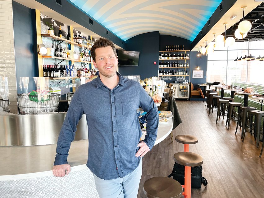 Sean Huggard stands in front of the oyster bar at the new Blue Island Oyster Bar and Seafood location in Lone Tree.