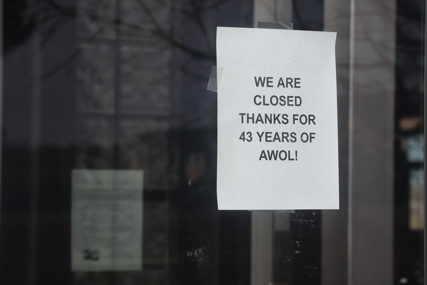 A sign on the dealership's front doors. “It’s sad that we had to close the store, not of our choosing," said owner Kathy Yevoli.