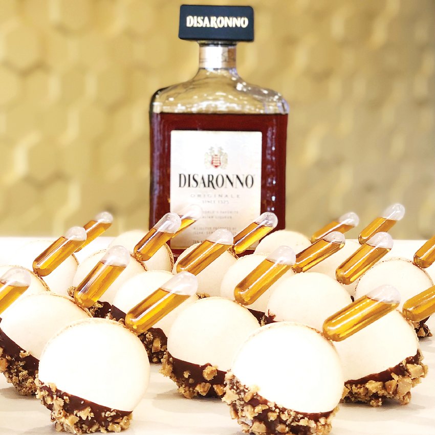 An adult treat, these macarons from Honey B's Macarons in Highlands Ranch are filled with almond marzipan, dipped in milk chocolate and toffee pieces, and infused with Disaronno Amaretto.