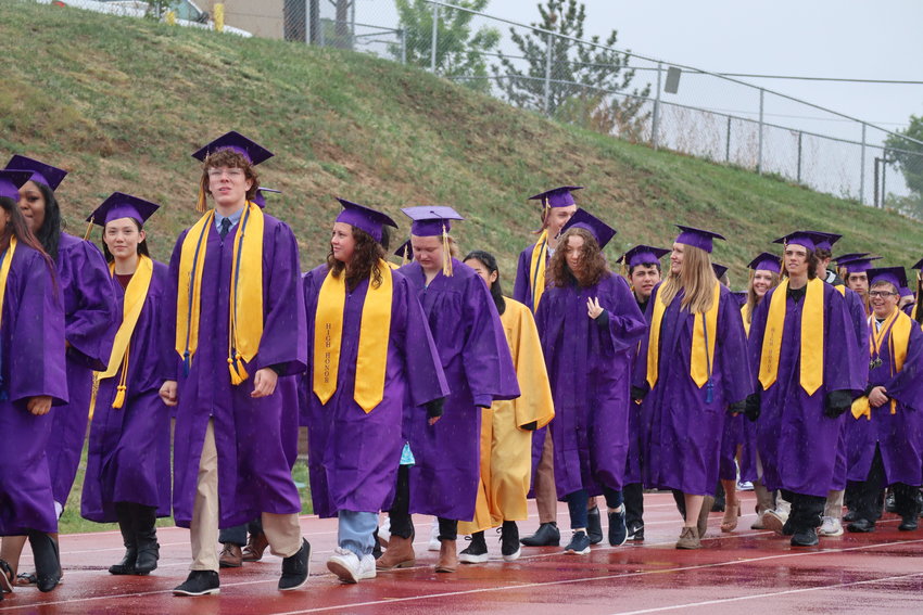 Littleton High School seniors in the rain the morning of their graduation ceremony on May 20, 2022.