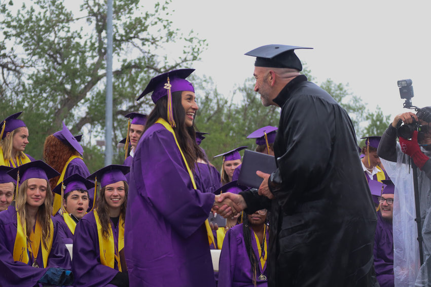A Littleton High School students receives their diploma.