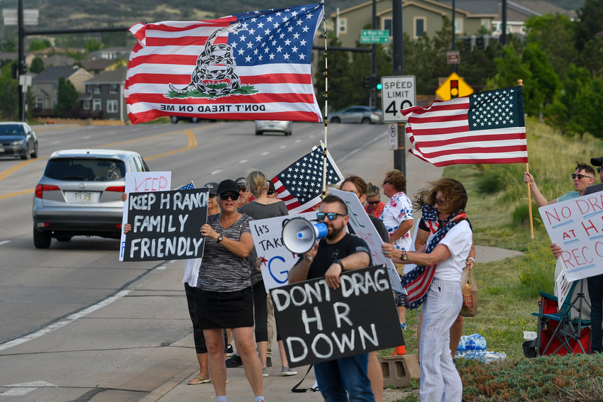 JUNE 17, 2022 - Protesters gather on a corner near the Southridge Recreation Center in Highlands Ranch holding signs in protest of a drag queen show that was held at the rec. center. The show was hosted by Comedians in Drag, Denver’s top drag queens who entertain with their comedy and musical performances. The event was sold out. (Photo by John Leyba/Special to the Colorado Sun)