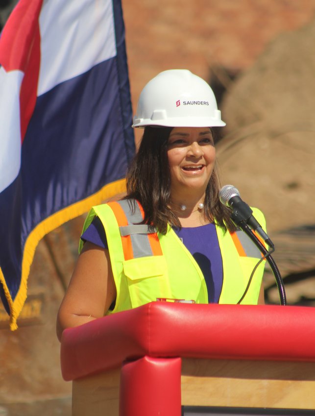 Adams County Commissioner Lynn Baca, a Brighton High School graduate, calls the STEM/CTE program at Brighton High School "an opportunity for students to look at college prep work" during an Aug. 11 groundbreaking program.