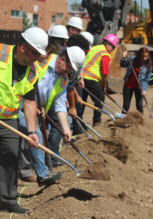 It's time for dignitaries, such as 27J Superintendent Chris Fiedler, far left, 27J board President Greg Piotraschke, third from left, and BHS Principal Shelly Genereux, far end, to turn shovels and officially break ground for the new BHS STEM/CTE Center Aug. 11.