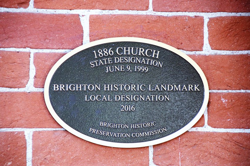 The 2016 plaque marking the 1886 Church at 147 S. Main St. as a historic building.