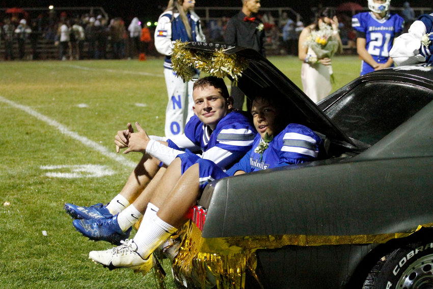 When it rains on your homecoming night and you still want to participate in halftime activities at the football game, you climb into the trunk of car, which is what Kaidyn Taylor, left, and Camren Galicia did Sept. 9. Both were members of their class' homecoming royalty, which was saluted at halftime of the game.