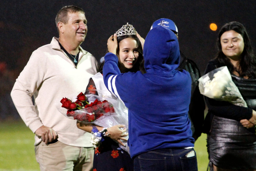 Tricia Hammond gets the ceremonial tiara after her selection as Fort Lupton High School homecoming queen Sept. 9 at halftime of the football game between the Bluedevils and Weld Central High School.