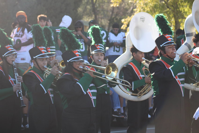 Adams City High School's band warms up before the start of the annual homecoming parade Sept. 17.