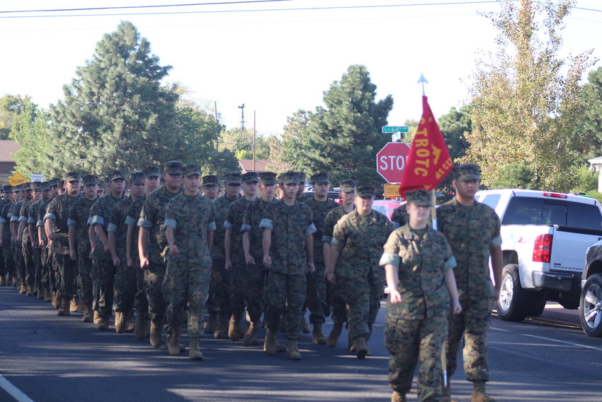 Adams City High School's Marine Corps Junior ROTC program gets the first position behind the color guard for this year's ACHS homecoming parade.