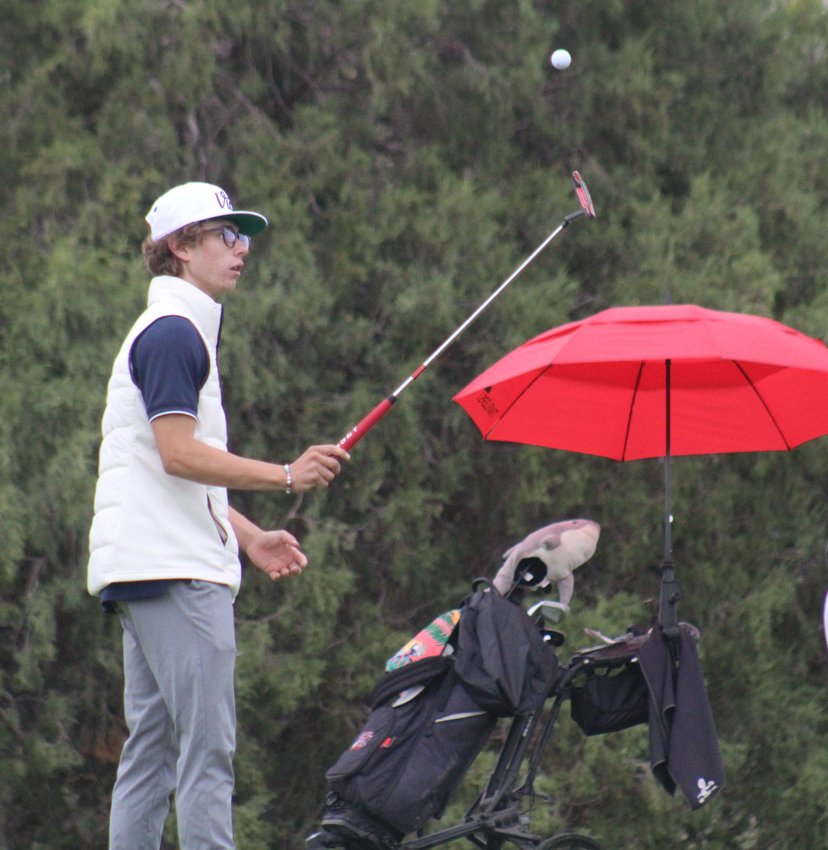 Frederick High School senior Teagun Boen cleans up after the seventh hole at the class 4A Region 2 golf tournament at Riverdale Knolls in Brighton. Boen shot a 10-over 81.