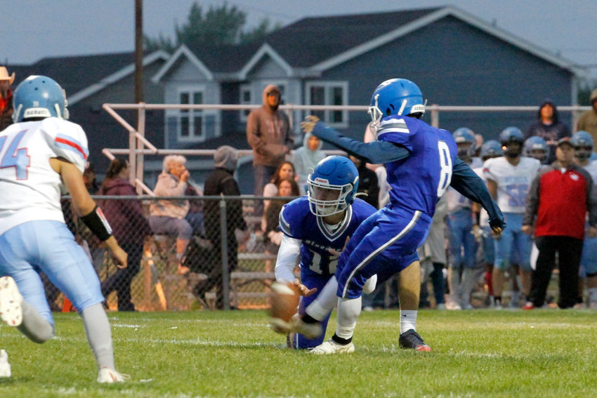 Jonathan Gonzalez (8) makes an extra point for the Fort Lupton Bluedevils during their homecoming game against Weld Central Sept. 9.