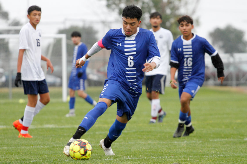 Jonathan Gonzalez dribbles the ball towards goal during his game against The Pinnacle Sep. 21 in Fort Lupton.