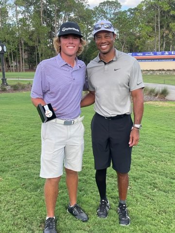 Brighton's Kyle Leydon, left, gets the chance to pose for a picture with golfing great Tiger Woods.