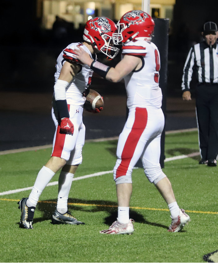 Brighton's Kevin Day celebrates with teammate Jordan Leete after scoring a touchdown during a Sept. 30 game against Prairie View.