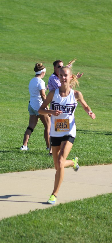 Stargate School's Allison Pippert is on her way to a class 3A Metro League cross country title in Broomfield Oct. 6. She posted a time of 18:44, almost a second and a half faster than the second-place finisher, Molly Zann of Kent Denver.