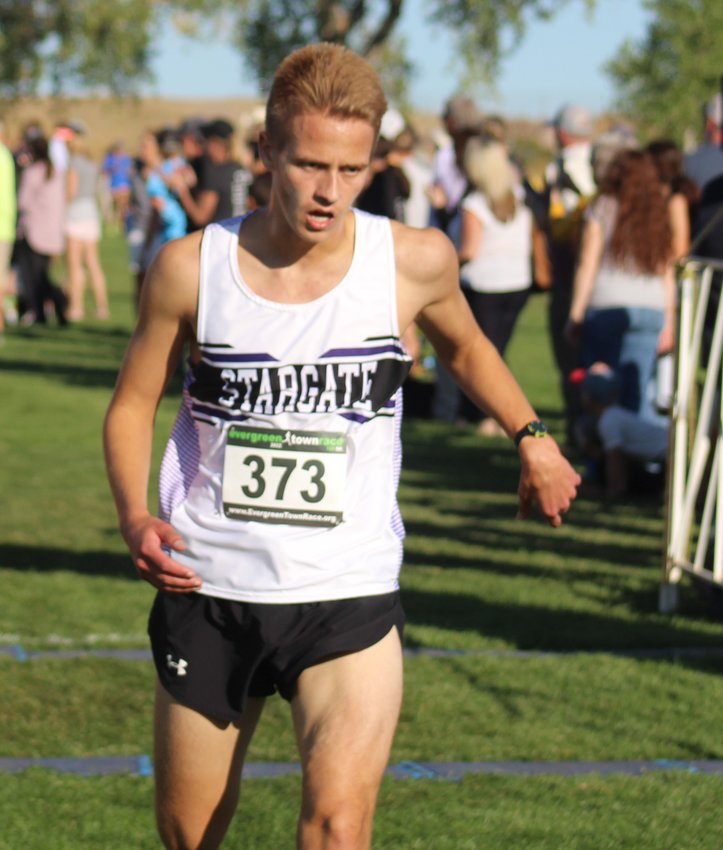Andrew Sawyer of the Eagles crosses the finish line with a time of 20:06 at the class 3A Metro League cross country meet Oct. 6 in Broomfield. He placed 41st.
