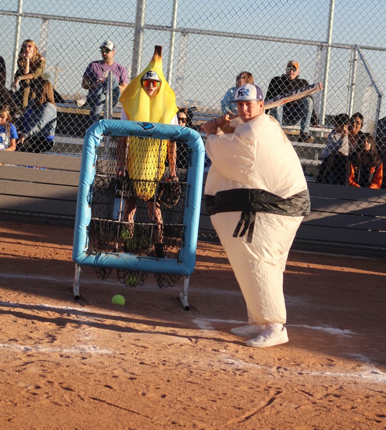 Mason Rendon of Riverdale Ridge prepares to take his swings during an Oct. 31 costumed game involving Ravens' softball and baseball players.