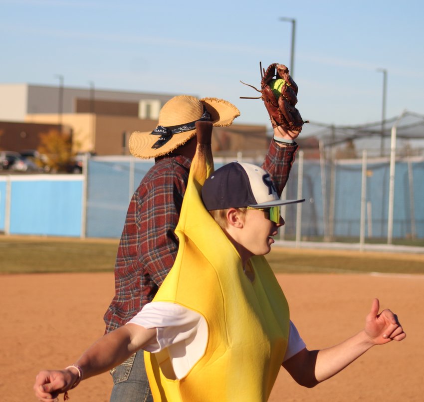When was the last time you saw something like this? a monk (Daniel Hoodak) successfully tags out a banana (Caden Beall-Steiner) during an Oct. 31 game involving players from Riverdale Ridge's softball and baseball teams.