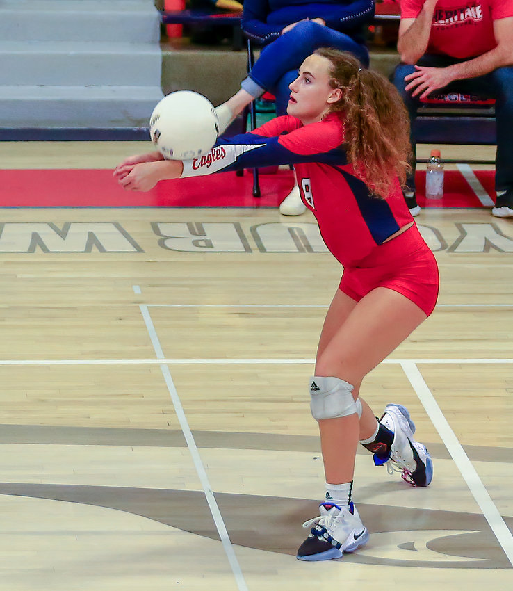 Heritage's senior setter, Annika Sokol, pushes the ball toward a teammate during her team's three-set win over Horizon High School Nov. 4. The win sent the Eagles into the state 5A tournament.