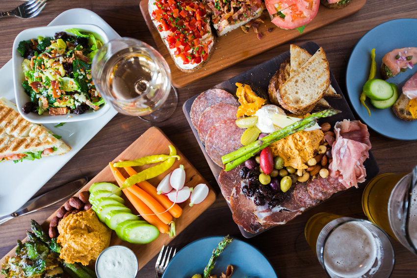 Postino Winecafe, which has four locations in Denver and Highlands Ranch, offers a variety of board appetizers that can be ordered for take out. Chad Halbrook, assistant manager for the Postino on Broadway, said the communal nature of charcuterie makes it a common choice for groups and parties.