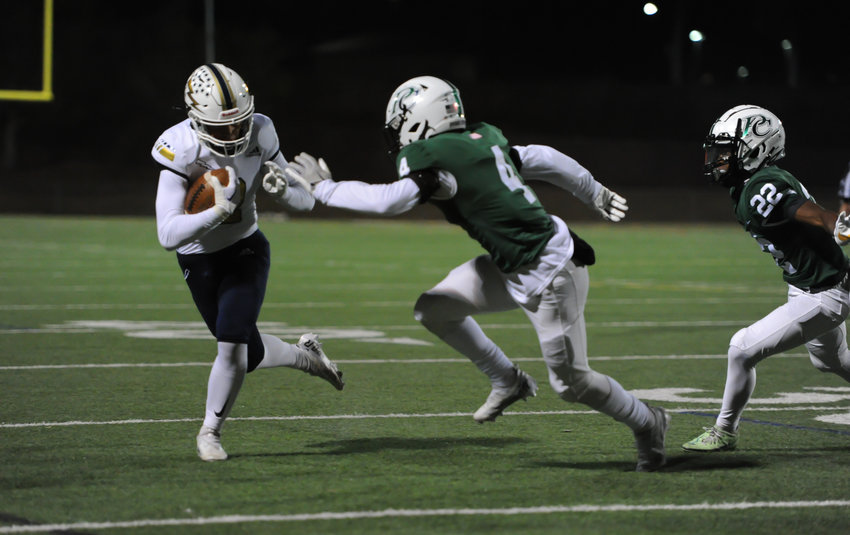 Legacy wide receiver Trey Javorek, left, tries to elude Pine Creek defenders Cannon Budge (4) and Justis Nicholson in a CHSAA 5A playoff game Nov. 11, at District 20 Stadium in Colorado Springs. The Lightning's 2022 playoff run ended in a 30-24 loss to the Eagles.