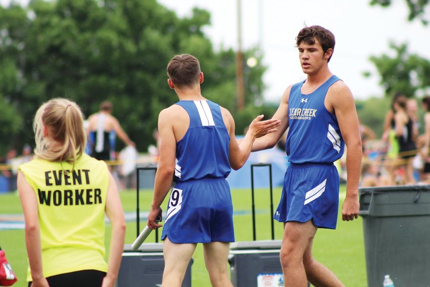 Clear Creek's Sean Mauracher, left, and Bode Baker celebrate after finishing the 2A 4x200 meter relay in June 2021.