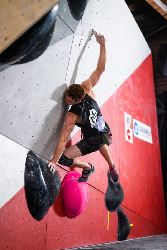 Ross Fulkerson attempts to climb a problem at the Spot Climbing Gym in Denver during finals of boulder portion of the National Championship Nov. 10.