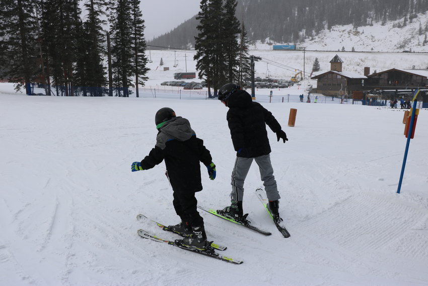 Two students work on their skiing skills.