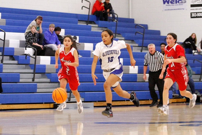 Fort Lupton freshman Marley Gomez (10) catches the ball on a fast break against multiple Arvada players. The Bluedevils fell to the Bulldogs in their home league match 37-22 Jan. 19.