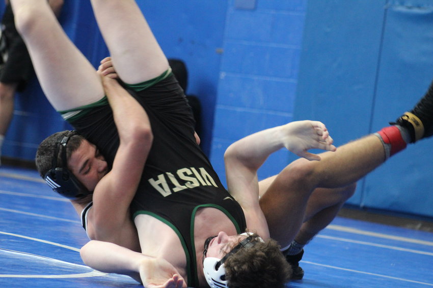 Brighton's Bryce BravoPacker turns Mountain Vista's Matthew Kimberly on his back during a 150-pound, first-round match at the Top of the Rockies tournament at Centaurus High School Jan. 19. BravoPacker earned a 7-6 decision.