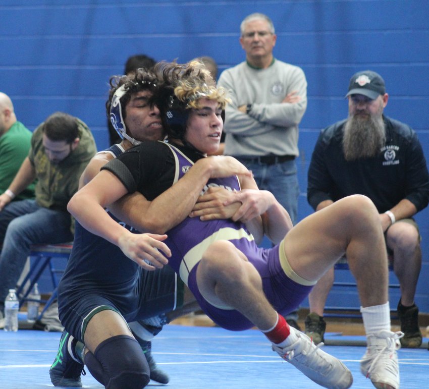 Diego Francisco of Rio Rancho, N.M. High School has control of the proceedings against Holy Family's Santiago Guerrero in the first round of 150-pound matches at the Top of the Rockies tournament Jan. 19. Francisco won by a major, 12-1 decision.